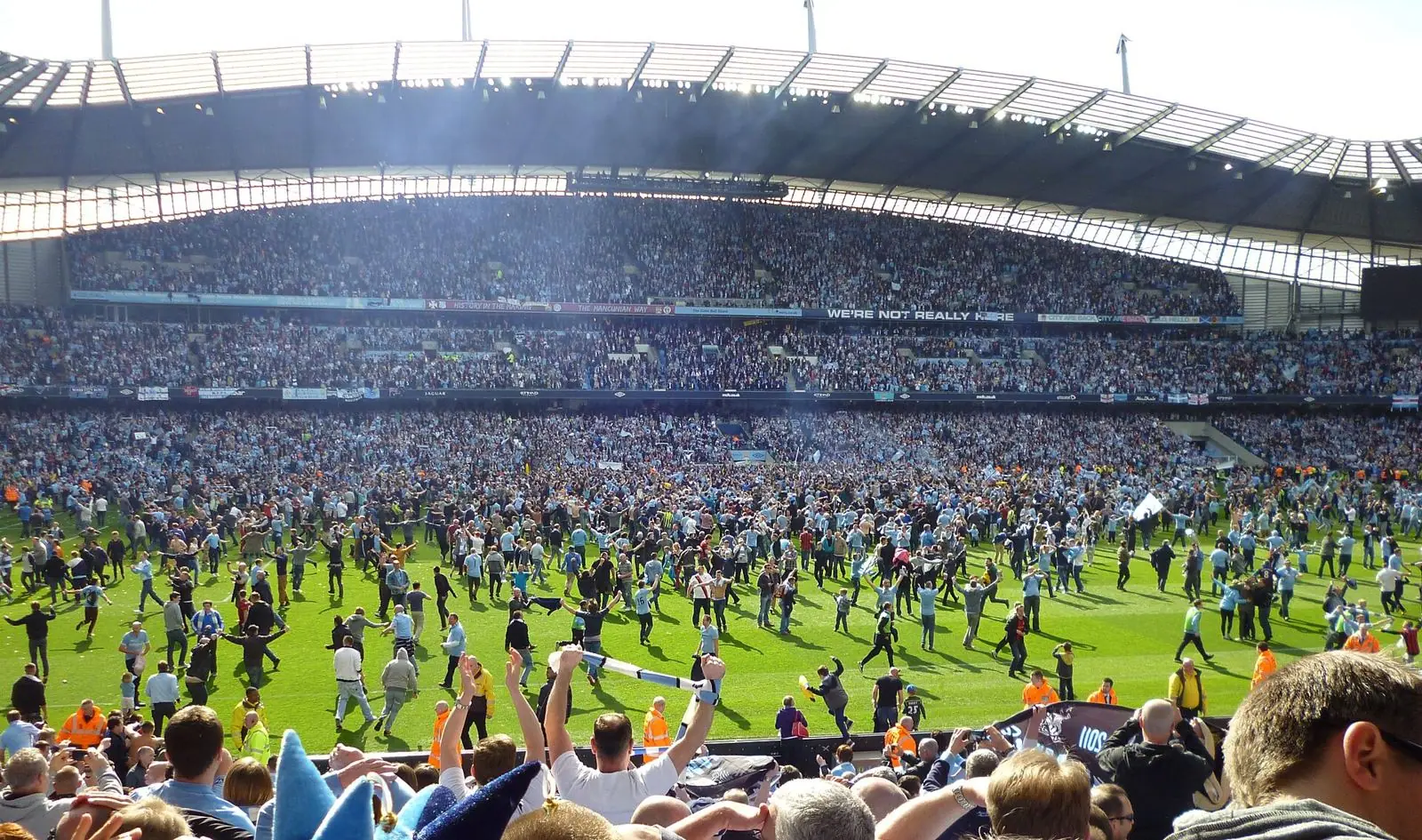 Manchester City fans invade the Etihad pitch after the 3-2 win over QPR that clinched the 2011-12 title
