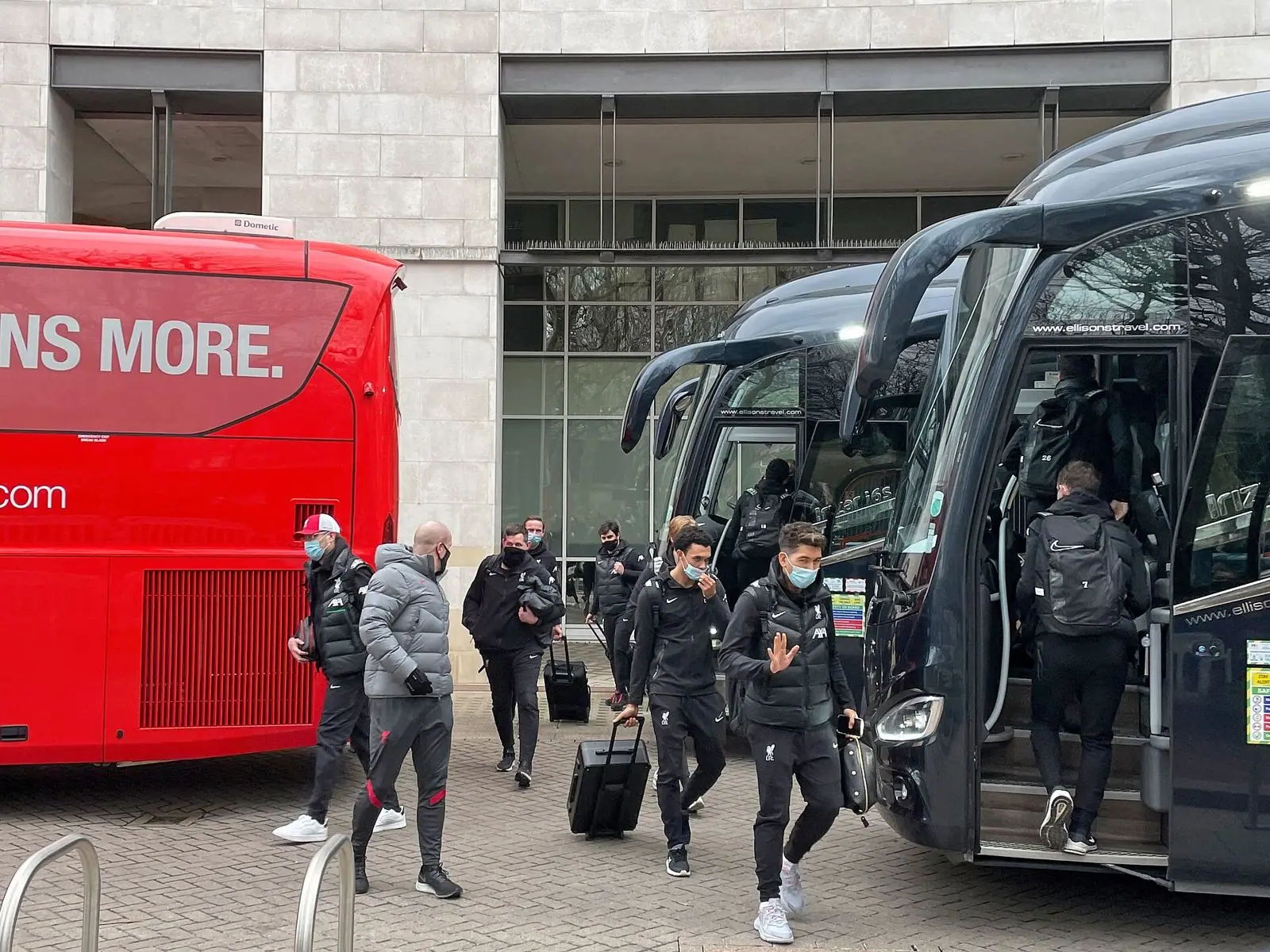 Firmino, Alexander-Arnold and Klopp leaving the Liverpool team bus, 2020-21 season