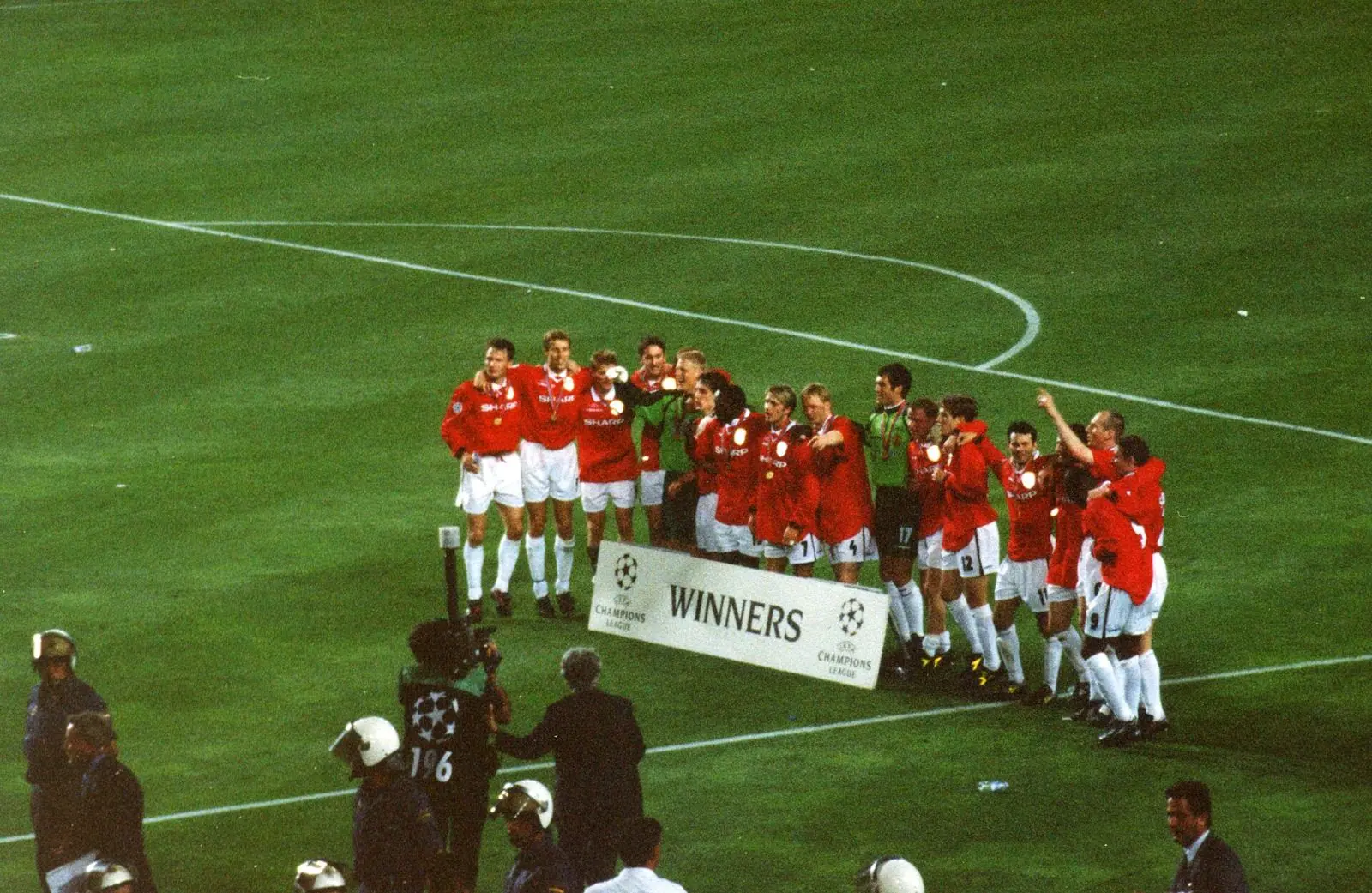 Manchester United players celebrate winning the 1999 Champions League Final at the Camp Nou