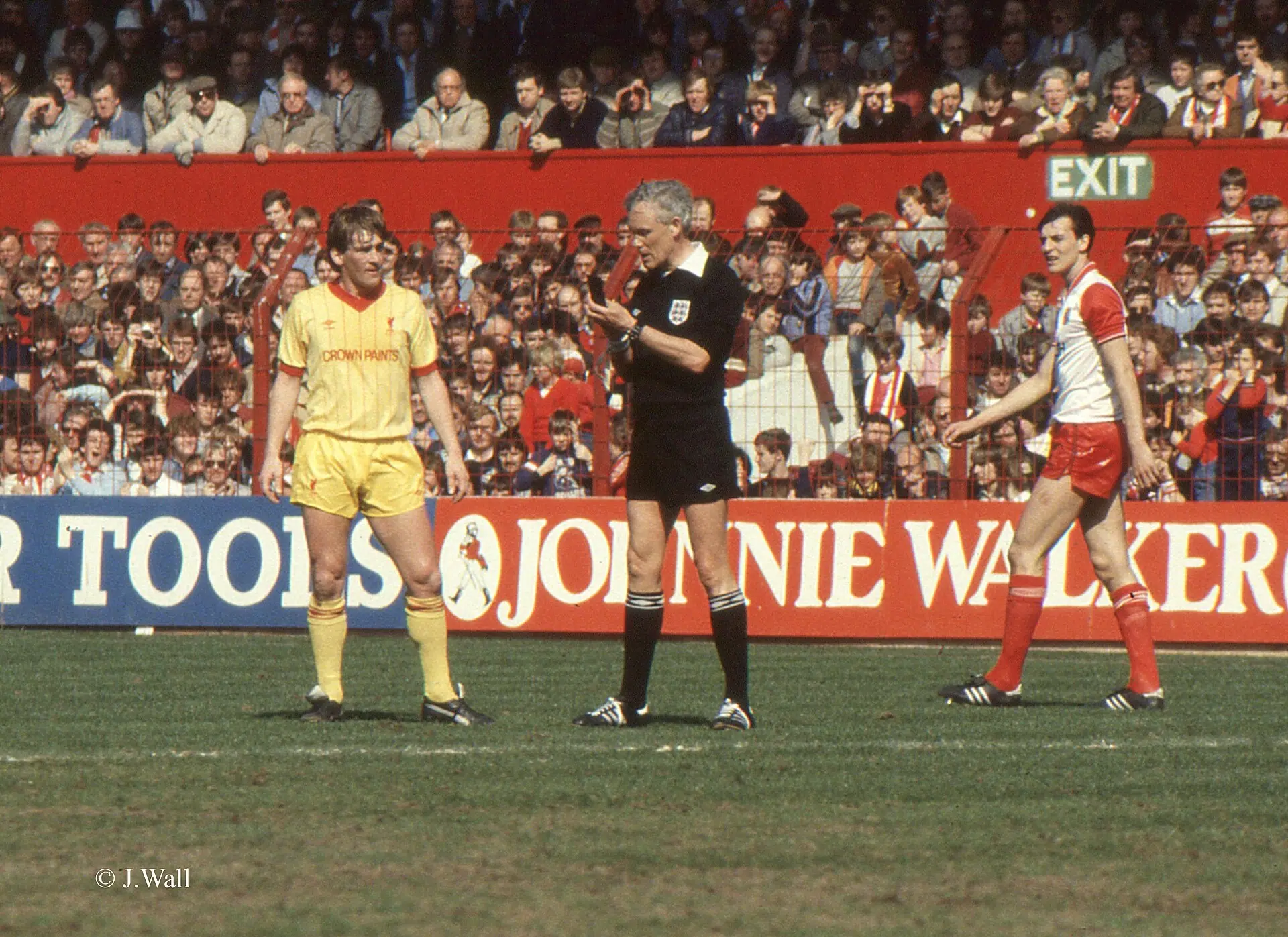 Kenny Dalglish in Liverpool's yellow away kit against Stoke City around 1983-84, five years after Wembley