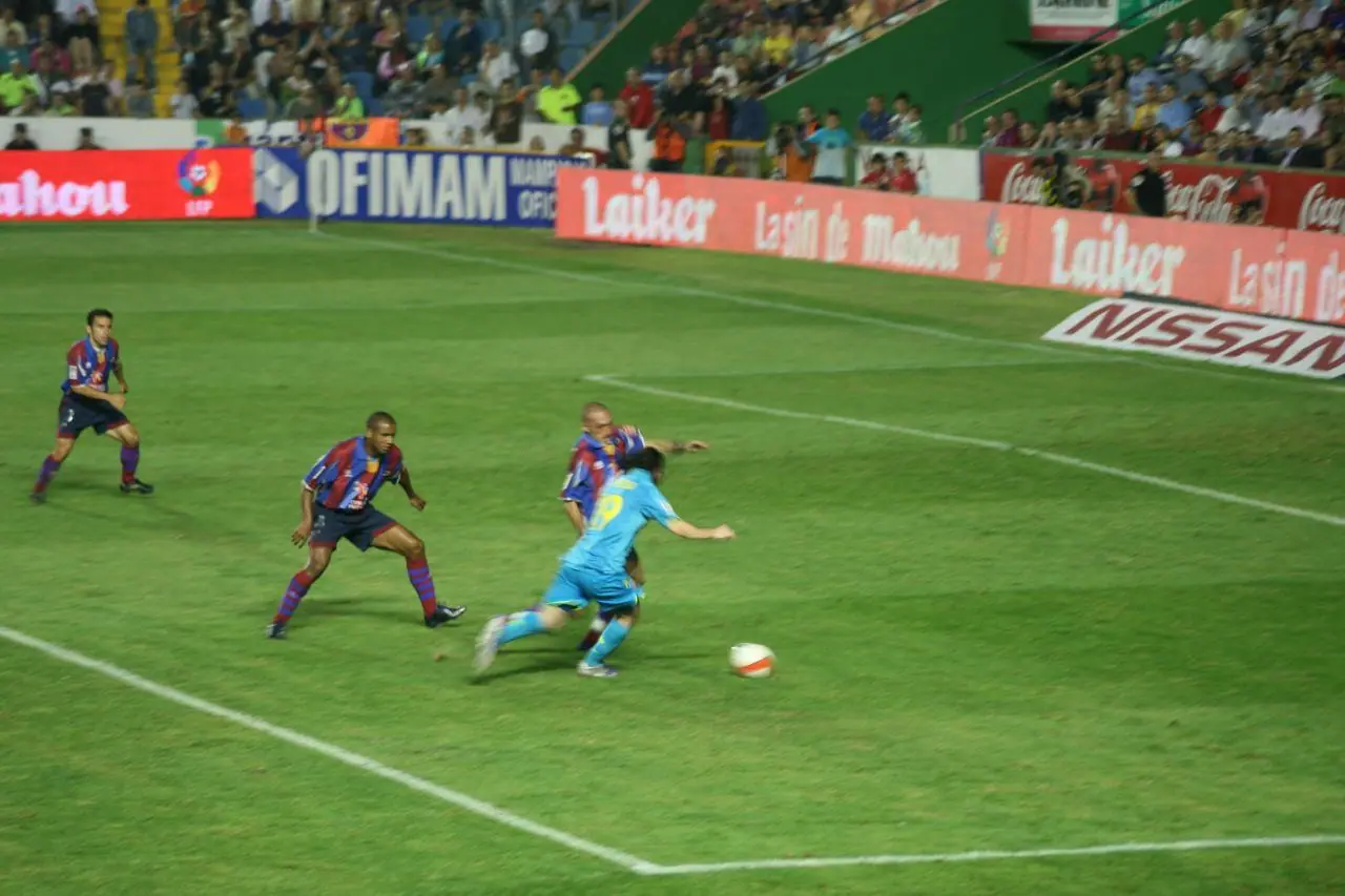 Messi takes it round a defender, Levante v Barcelona, Sept 2007