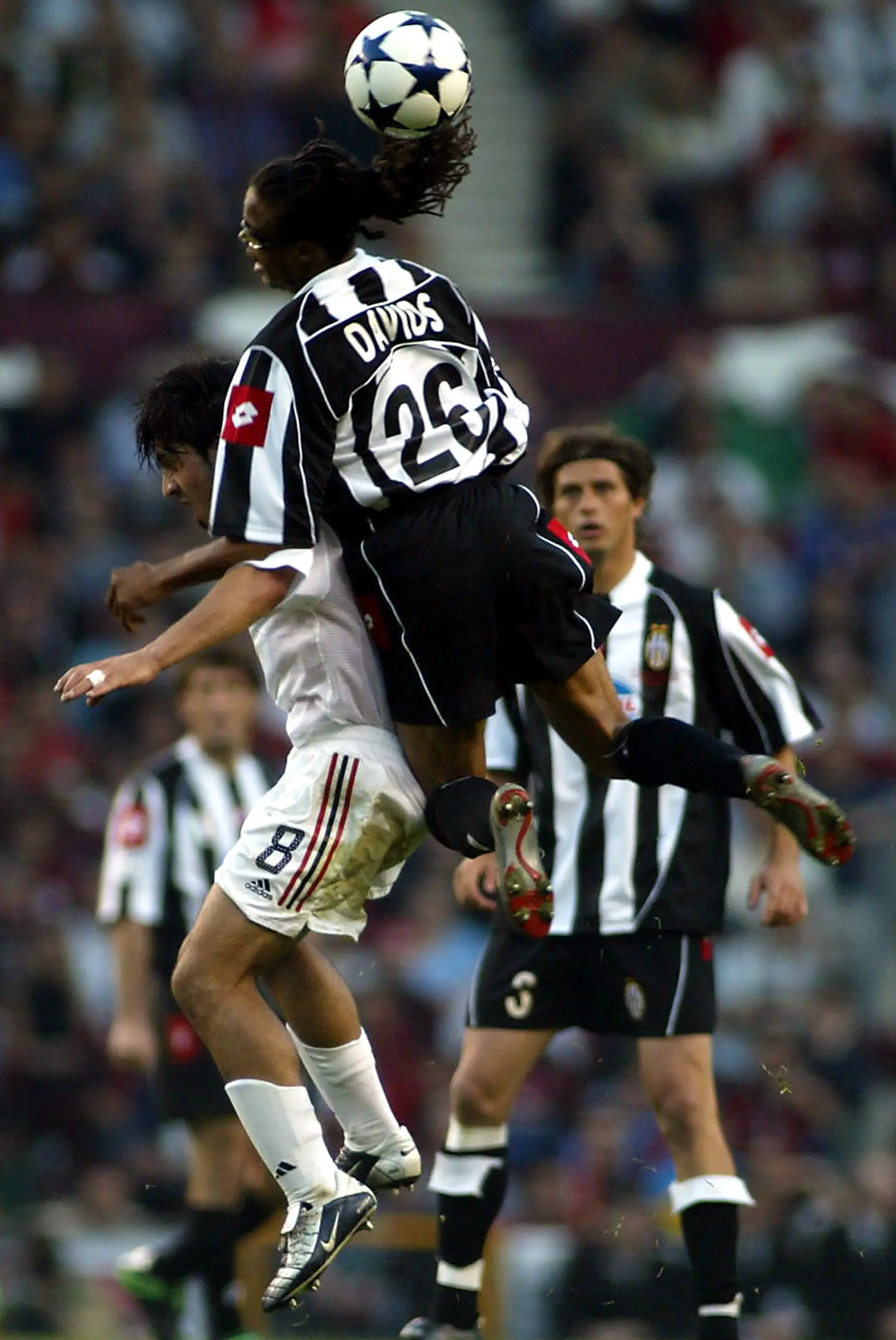 Edgar Davids of Juventus rising over Gennaro Gattuso of Milan in the 2003 Champions League final at Old Trafford